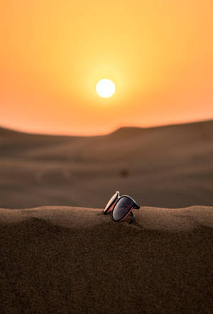 Vacation Glasses On Sand Dune Wallpaper