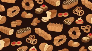 Varied Assortment Of Freshly Baked Bread And Biscuits Wallpaper