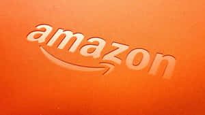 Vibrant Amazon Uk Logo Against A Stunning Orange Backdrop Wallpaper