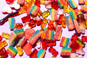 Vibrant Array Of Chewy Gummies And Candies Wallpaper