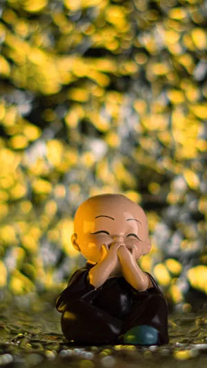 Vibrant Colored Laughing Buddha Statue Wallpaper