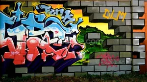 Vibrant Expression On A Graffiti Mural Wall Wallpaper