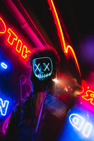 Vibrant Neon Lights In The Urban Night Wallpaper