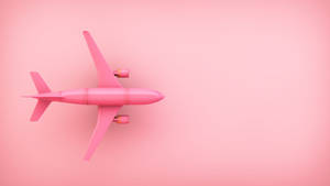 Vibrant Pink Toy Aeroplane Brightening Up The Sky Wallpaper