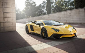 Vibrant Yellow Lamborghini Aventador Sports Car Wallpaper