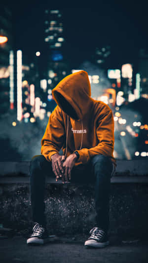 Vibrant Yet Melancholic - Cool Sad Boy In Yellow Hoodie Wallpaper