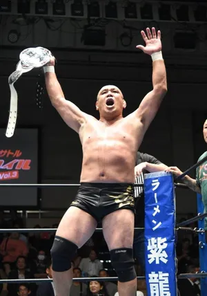 Victorious M M A Fighter Raising Belt Wallpaper