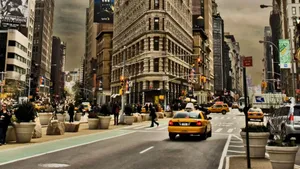View Of A Bustling New York City Street Wallpaper