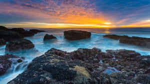 View The Stunning Ocean While Unwinding With Your Ipad Wallpaper