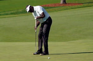 Vijay Singh Checking Golf Ball Wallpaper