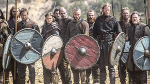 Vikings Posing With Weapons Wallpaper