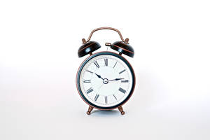 Vintage Alarm Clock Illuminated In Dark Wallpaper