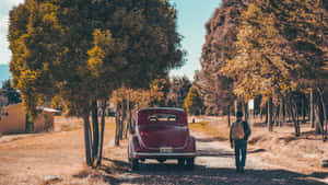 Vintage Autumn Man Walking Red Car Wallpaper