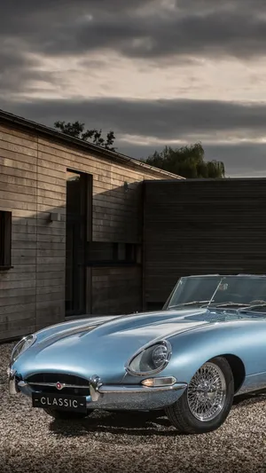 Vintage Car Near Brick House Iphone Wallpaper