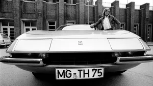 Vintage Carand Man Standing Blackand White Wallpaper