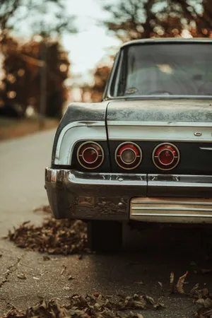 Vintage Chrome Car At The Road Wallpaper
