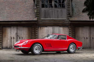 Vintage Ferrari Outside An Old Garage Wallpaper