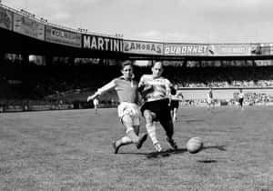 Vintage Football Match Action Wallpaper