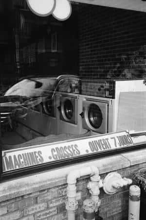 Vintage Laundromat Window Display Wallpaper