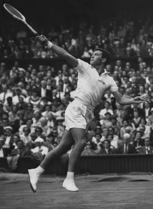 Vintage Tennis Player Action Shot Wallpaper