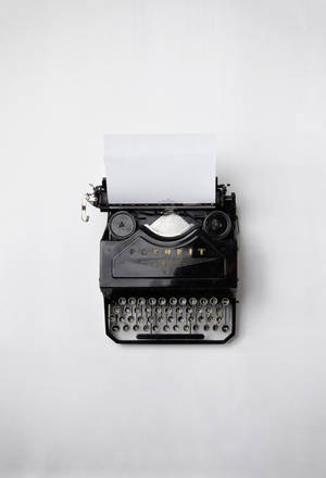 Vintage Typewriter On A Desk Wallpaper
