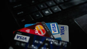 Visa And Mastercard Credit Cards On A Laptop Shot Wallpaper