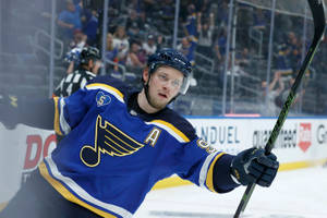 Vladimir Tarasenko Holding Hockey Stick With Left Hand And Holding Side Rink Rails Wallpaper