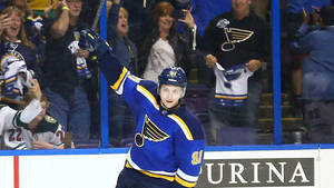 Vladimir Tarasenko Smiling While Holding Hockey Stick With Audience Cheering Wallpaper