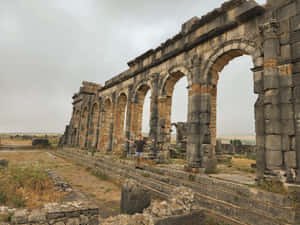 Volubilis Cloudy Sky Many Arches Wallpaper
