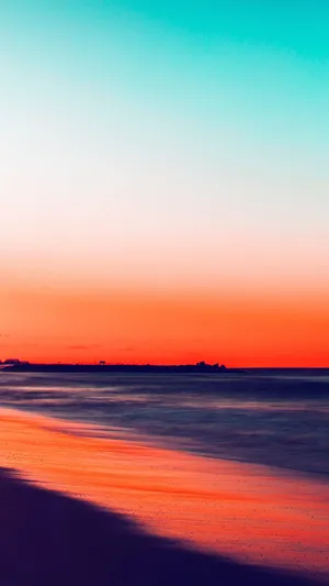 Watch The Sunset Over A Secluded Beach With An Iphone Wallpaper