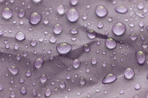 Water Droplets On Purple Fabric Wallpaper