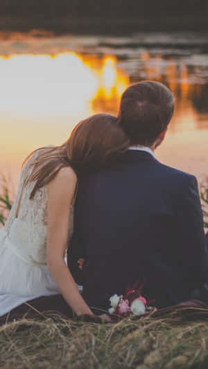 Wedding Couple Lake Sitting Wallpaper