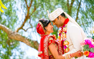 Wedding Couple Red And White Attire Wallpaper