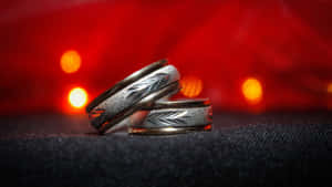 Wedding Ring Against Blurred Light Wallpaper