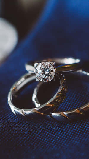 Wedding Ring On Blue Cloth Wallpaper