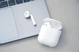 White Airpods And Macbook Wallpaper