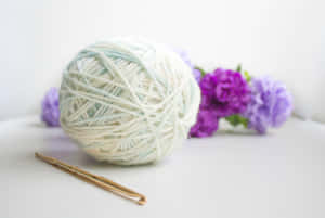 White Ball Of Knitting Wool Wallpaper