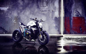 White Bmw Motorcycle Sitting In A Garage Wallpaper