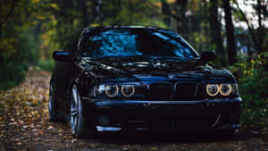 White Bmw Sports Car Gleaming In The City Of London Wallpaper