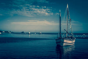 White Boat On A Calm Sea Wallpaper