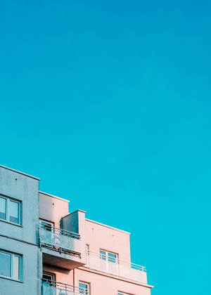 White Building Under Blue Sky Wallpaper