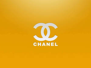 White Chanel Logo On Golden Yellow Wallpaper