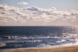 White Clouds Above Blue Virginia Beach Wallpaper