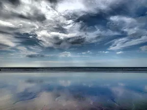 White Cloudy Sky On Woolacombe Beach Wallpaper