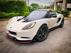 White Lotus Elise Sports Car Parked Wallpaper