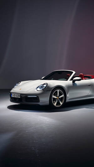 White Porsche 911 Under Spotlight Wallpaper