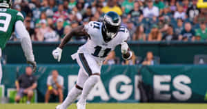 Wide Receiver Aj Brown Sprinting Wallpaper