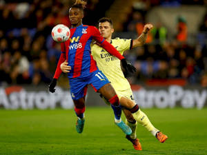 Wilfried Zaha Blocking Opponent Wallpaper