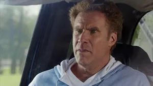 Will Ferrell Striking A Confident Pose In A Suit Wallpaper