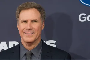 Will Ferrell Striking A Funny Pose While Holding A Basketball In A Promotional Photo Shoot. Wallpaper